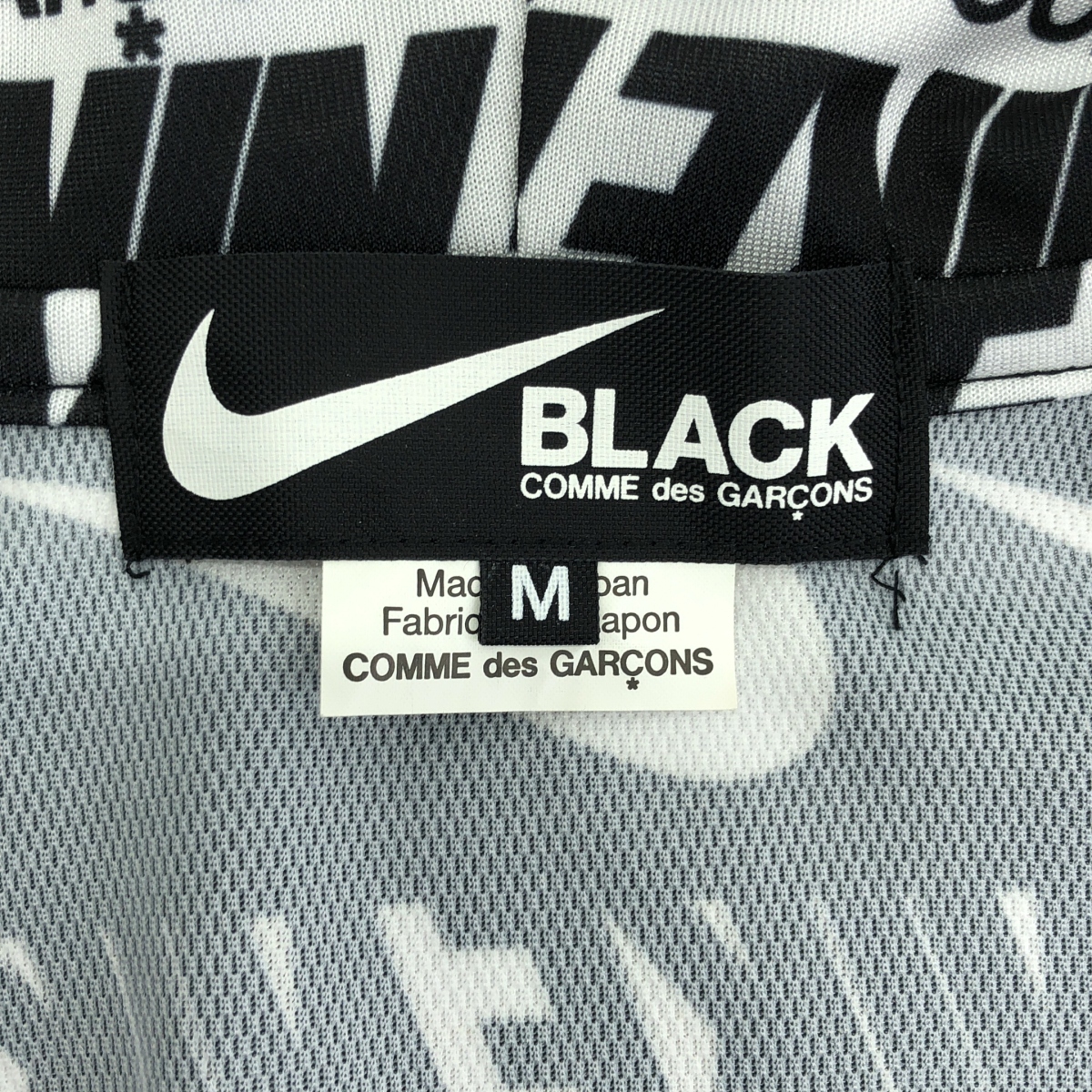 BLACK COMME des GARCONS / ブラックコムデギャルソン NIKE LOGO ZIP PARKA ロゴ総柄 ポリエステル ジップパーカー