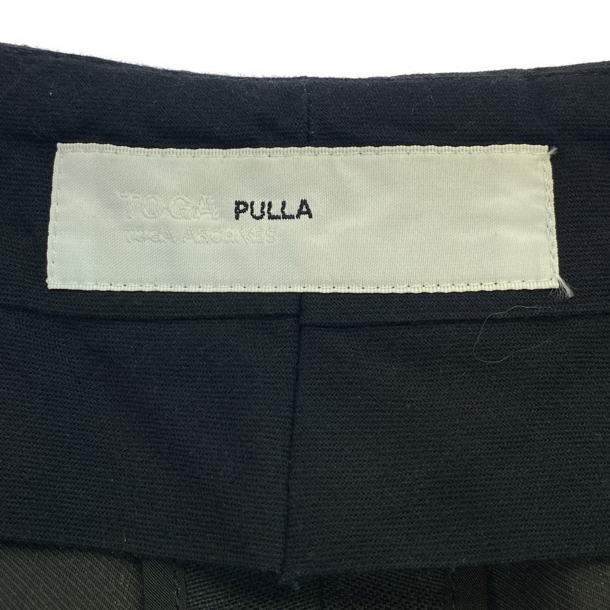TOGA PULLA / トーガプルラ シャンブレーウール コンチョ サイドライン パンツ