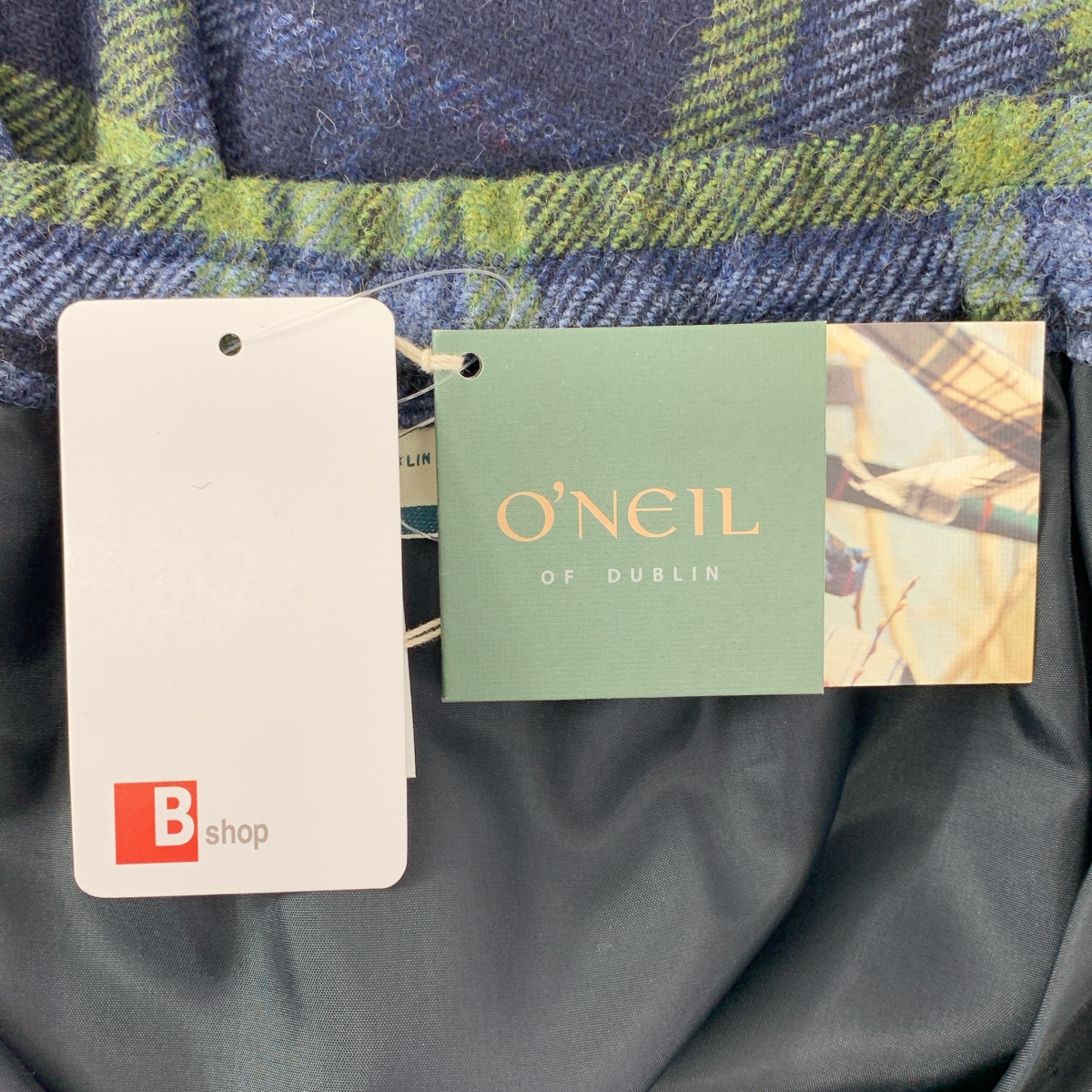 O'NEIL OF DUBLIN / オニールオブダブリン アシンメトリー アジャスター ラップ キルトスカート