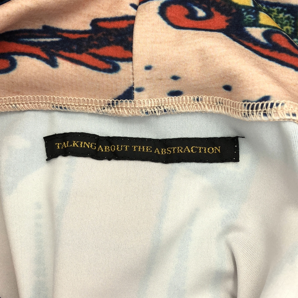TALKING ABOUT THE ABSTRACTION / トーキングアバウトジアブストラククション 総柄 転写 ストレッチ プルオーバー フーディ
