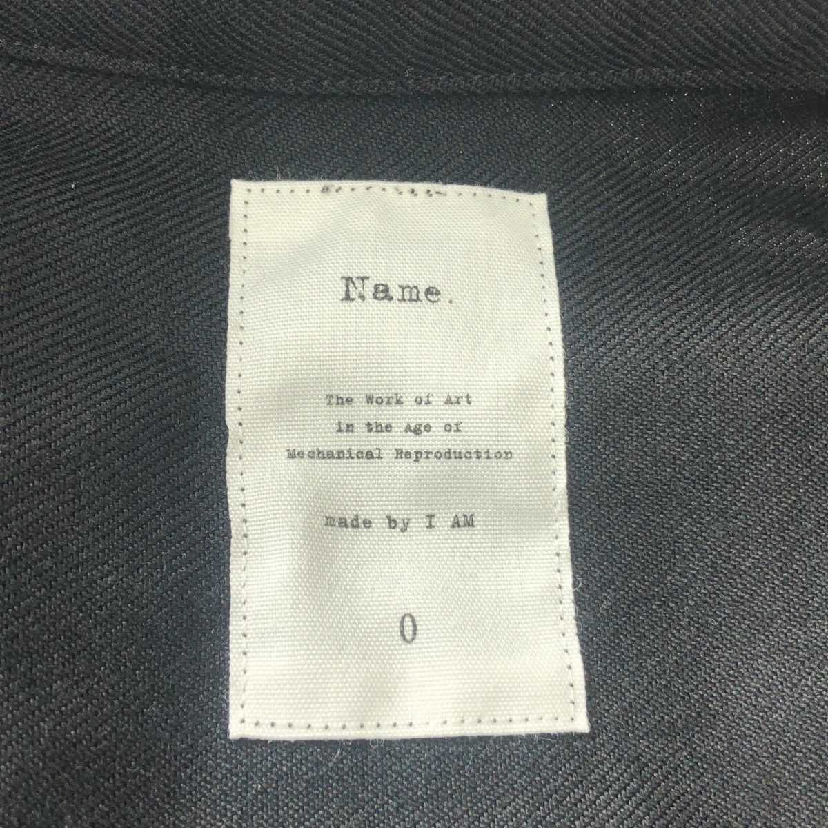 Name. / ネーム オフスケールウール フライフロントシャツ