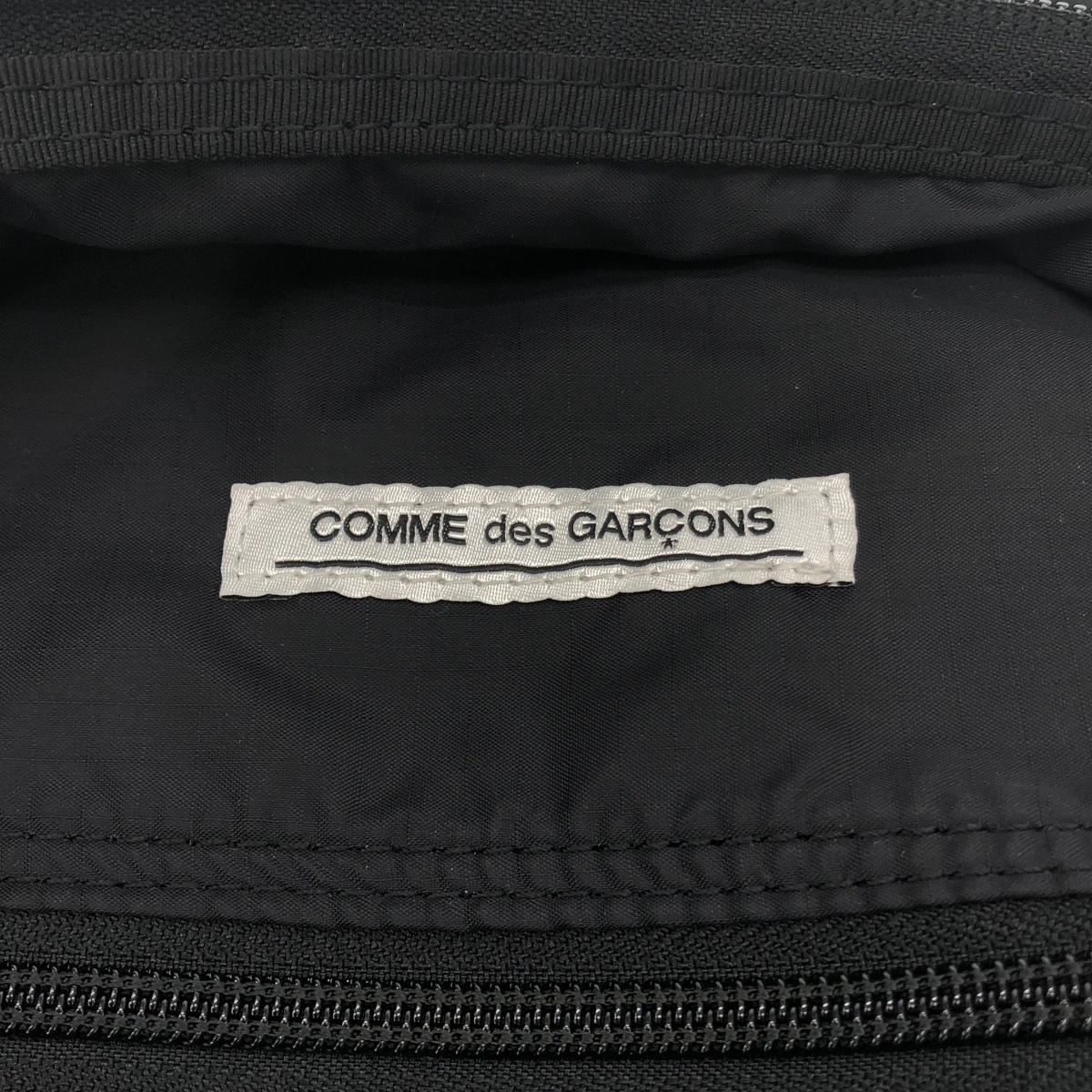 COMME des GARCONS / コムデギャルソン 路面店限定 メッセージ プリント ナイロンバックパック リュック